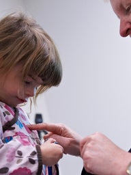 Primary Care visit - young girl with doctor