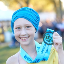 Parkway ambassador holding her medal