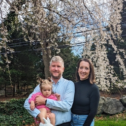 Couple in yard with baby