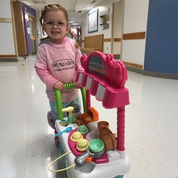 Charlotte with shopping cart in hospital