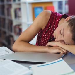 Girl asleep on books