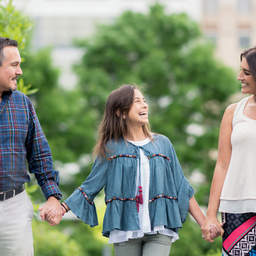 Paulina walking outside with her parents