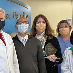 Group photo of CFDT team holding award