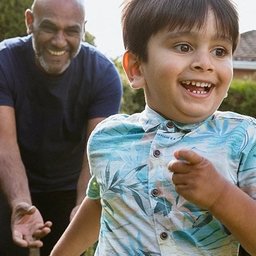 Chasing grandson in the garden during outdoors playtime.