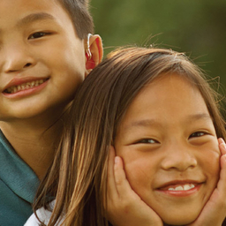 boy hugging girl and smiling