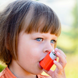 little girl with inhaler