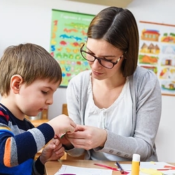 Teacher with child in classroom