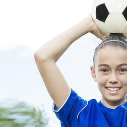 GIrl holding soccer ball