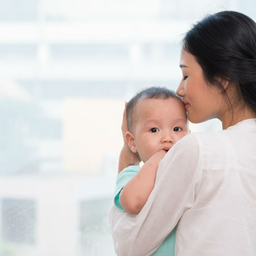 Mother holding young child