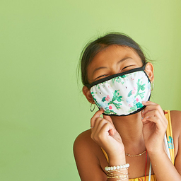 Young girl wearing a protective mask