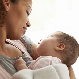 Mother holding healthy newborn