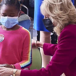 Jill Biden with a little girl at Karabots