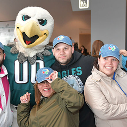 Group photo with Eagles mascot, Swoop