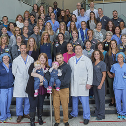 Twins, their parents, and the team at CHOP