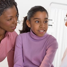 Doctor talking to patient and mother