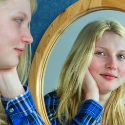 Girl smiling in mirror