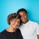 Mother and son on a blue wall