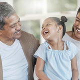 Grandpa with daughter and granddaughter laughing